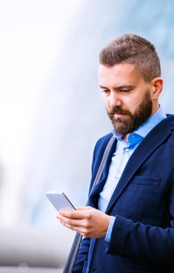 hipster-manager-with-smart-phone-london-city-hall-PBBAF8T